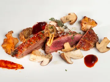 Presa ibérica con setas al horno Presa ibérica con setas al horno