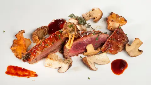 Presa ibérica con setas al horno Presa ibérica con setas al horno